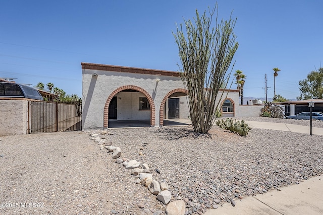 2366 N Camino Mateo, Tucson, AZ 85745 - view of front of house with stucco siding and a patio area