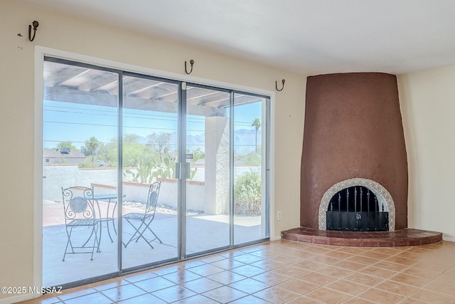 2366 N Camino Mateo, Tucson, AZ 85745 - unfurnished living room featuring tile patterned flooring and a fireplace