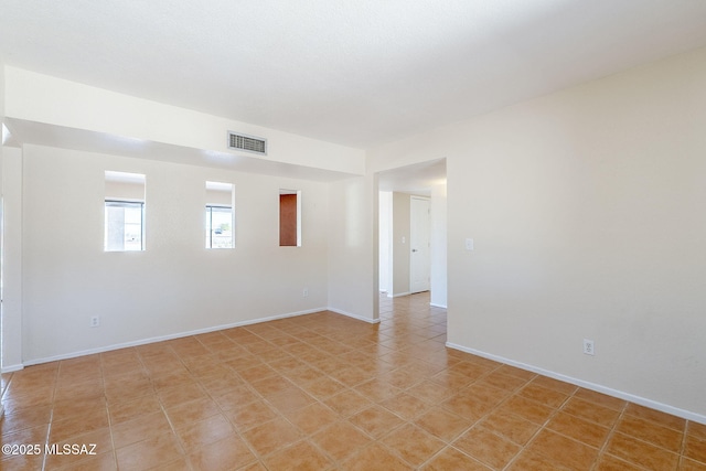 2366 N Camino Mateo, Tucson, AZ 85745 - unfurnished room featuring baseboards