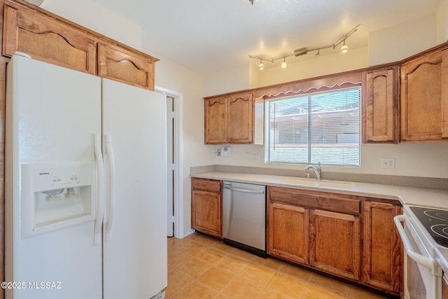 2366 N Camino Mateo, Tucson, AZ 85745 - kitchen with white appliances, brown cabinetry, and light countertops