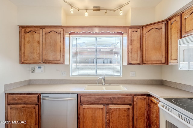 2366 N Camino Mateo, Tucson, AZ 85745 - kitchen with white appliances, light countertops, and brown cabinets