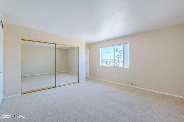 2366 N Camino Mateo, Tucson, AZ 85745 - unfurnished bedroom featuring carpet floors and a closet