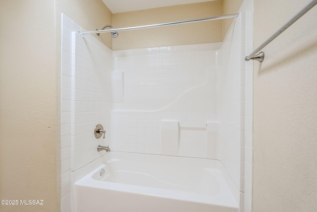 2366 N Camino Mateo, Tucson, AZ 85745 - full bath with bathing tub / shower combination and a textured wall
