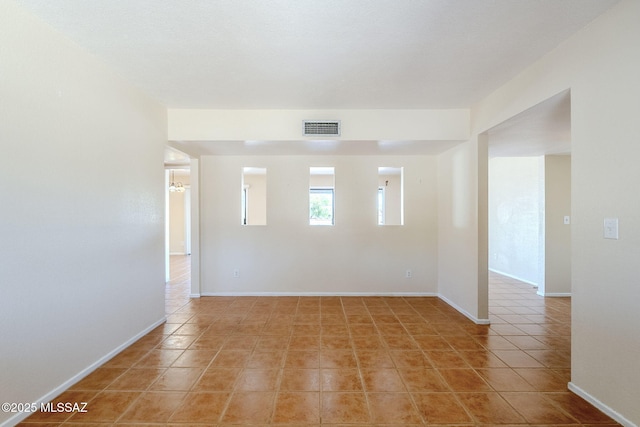 2366 N Camino Mateo, Tucson, AZ 85745 - empty room featuring light tile patterned floors and baseboards