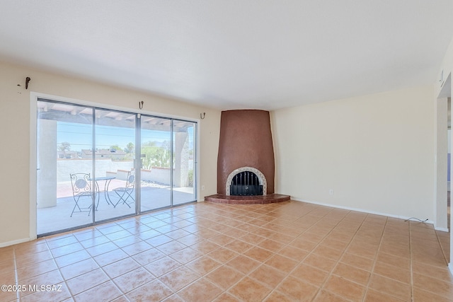 2366 N Camino Mateo, Tucson, AZ 85745 - unfurnished living room with a fireplace and light tile patterned floors
