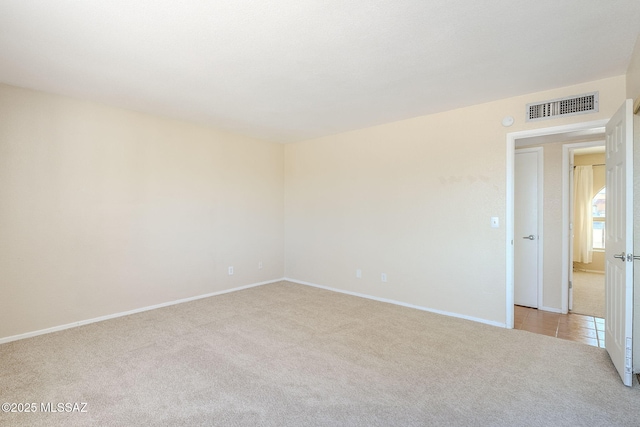 2366 N Camino Mateo, Tucson, AZ 85745 - empty room featuring light carpet and baseboards