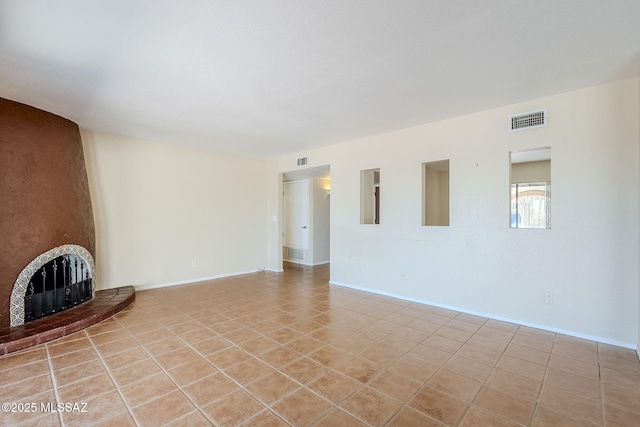 2366 N Camino Mateo, Tucson, AZ 85745 - unfurnished living room with light tile patterned floors and a fireplace