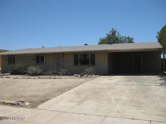 3885 W Mars St, Tucson, AZ 85741 - ranch-style home featuring concrete driveway and stucco siding