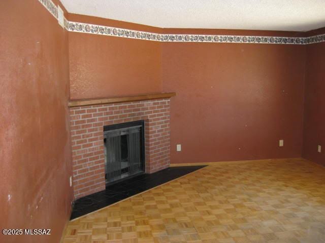 3885 W Mars St, Tucson, AZ 85741 - unfurnished living room featuring a fireplace