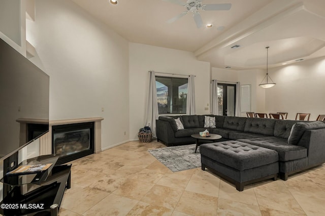 6859 N Placita Chula Vis, Tucson, AZ 85704 - living area with a ceiling fan, recessed lighting, a raised ceiling, and a glass covered fireplace