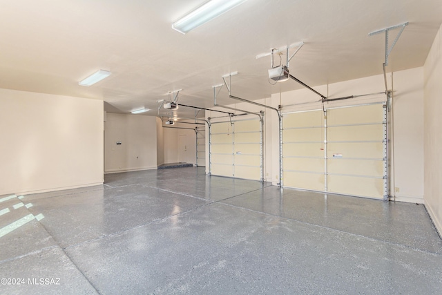 6859 N Placita Chula Vis, Tucson, AZ 85704 - garage featuring a garage door opener