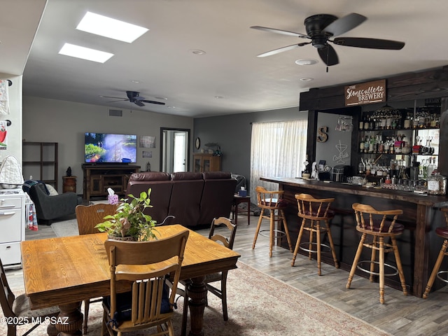 7855 N Northern Ave, Tucson, AZ 85704 - dining space featuring ceiling fan, a dry bar, and wood finished floors