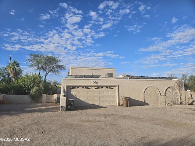7855 N Northern Ave, Tucson, AZ 85704 - view of outdoor structure featuring an attached garage and driveway