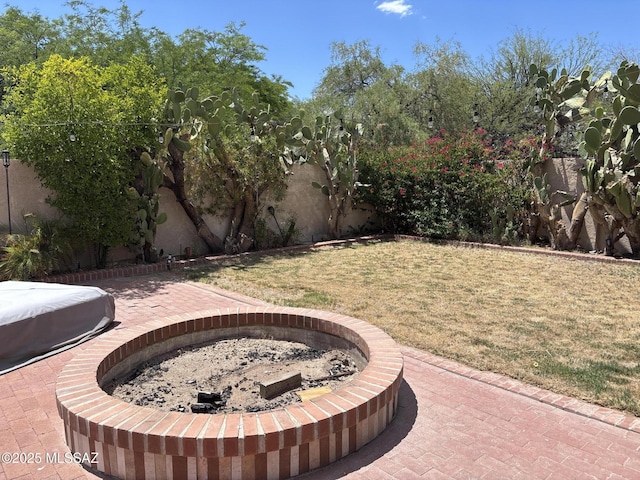 7855 N Northern Ave, Tucson, AZ 85704 - fenced backyard with a fire pit and a patio area