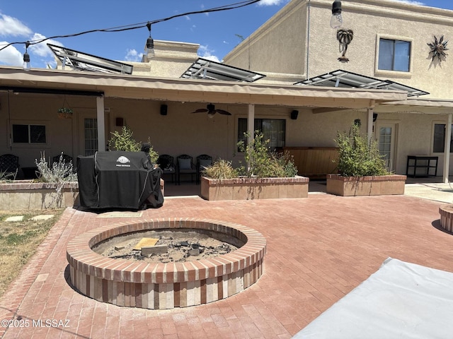 7855 N Northern Ave, Tucson, AZ 85704 - view of patio with a fire pit, ceiling fan, and grilling area