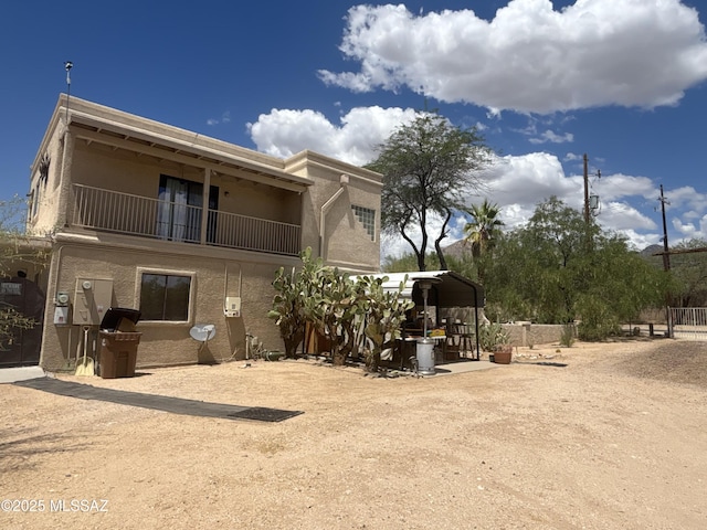 7855 N Northern Ave, Tucson, AZ 85704 - view of front facade featuring stucco siding and a balcony