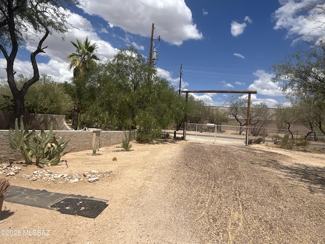 7855 N Northern Ave, Tucson, AZ 85704 - view of dirt / gravel road featuring a gated entry and a gate