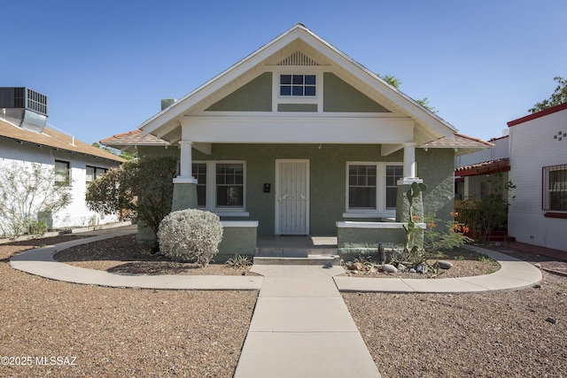 642 E 2nd St, Tucson, AZ 85705 - view of front facade featuring covered porch and stucco siding