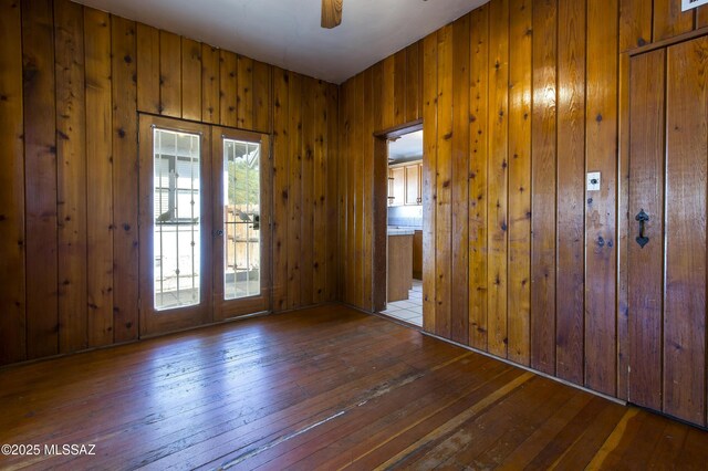 642 E 2nd St, Tucson, AZ 85705 - entryway with hardwood / wood-style flooring, wooden walls, french doors, and a ceiling fan