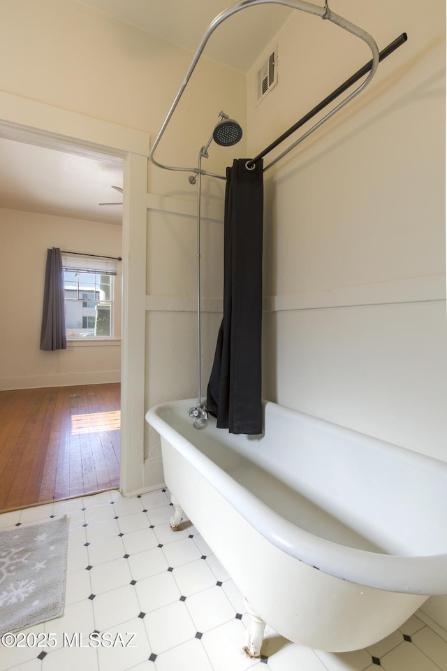 642 E 2nd St, Tucson, AZ 85705 - bathroom with shower / bath combo with shower curtain and baseboards