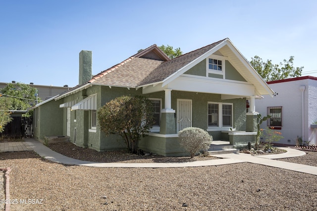 642 E 2nd St, Tucson, AZ 85705 - view of front of home featuring a porch, stucco siding, and a shingled roof