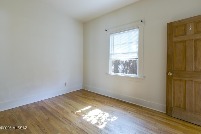 642 E 2nd St, Tucson, AZ 85705 - empty room featuring baseboards and light wood-style floors