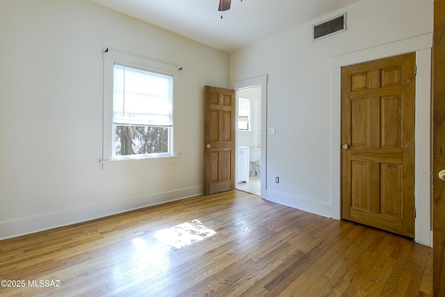 642 E 2nd St, Tucson, AZ 85705 - unfurnished bedroom featuring hardwood / wood-style flooring and a ceiling fan