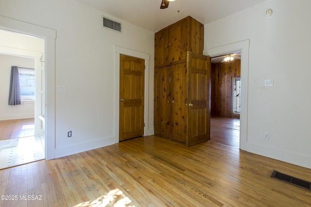 642 E 2nd St, Tucson, AZ 85705 - unfurnished bedroom featuring light wood-type flooring and baseboards