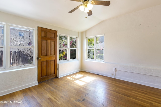 642 E 2nd St, Tucson, AZ 85705 - spare room featuring vaulted ceiling, hardwood / wood-style flooring, ceiling fan, and a textured wall
