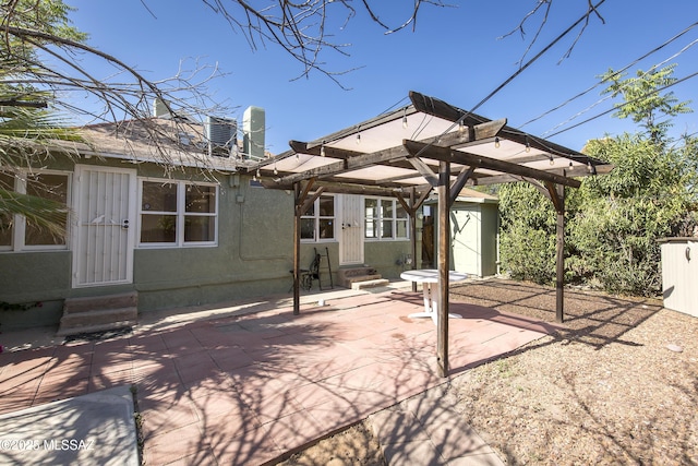 642 E 2nd St, Tucson, AZ 85705 - back of house featuring entry steps, a patio, and stucco siding