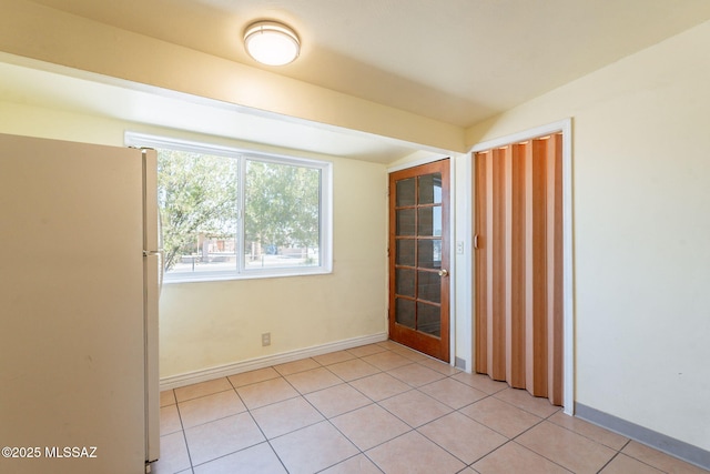 325 W Santa Maria St, Tucson, AZ 85706 - empty room with baseboards and light tile patterned flooring