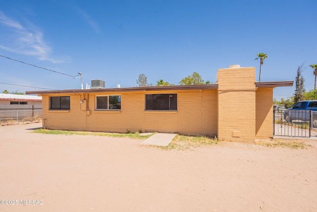 325 W Santa Maria St, Tucson, AZ 85706 - view of front of home with a chimney and brick siding