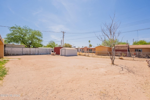 325 W Santa Maria St, Tucson, AZ 85706 - fenced backyard featuring a storage unit