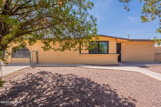 325 W Santa Maria St, Tucson, AZ 85706 - view of front of home featuring a gate and brick siding