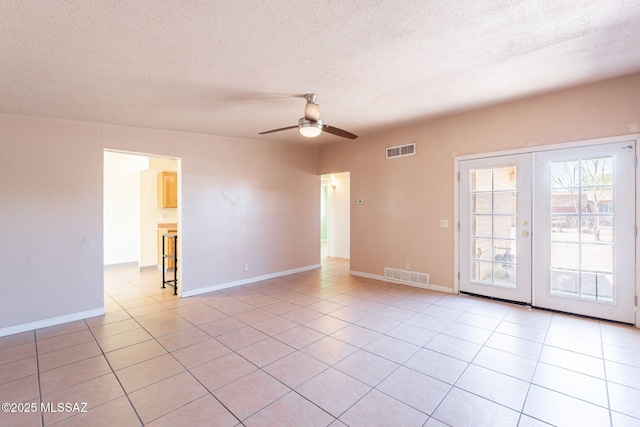 325 W Santa Maria St, Tucson, AZ 85706 - unfurnished room with ceiling fan, a textured ceiling, light tile patterned floors, and french doors