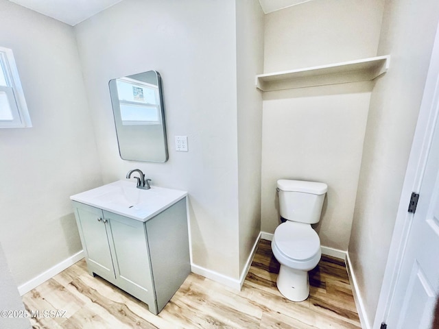 1105 S 1st Ave, Safford, AZ 85546 - bathroom featuring vanity, wood finished floors, and healthy amount of natural light