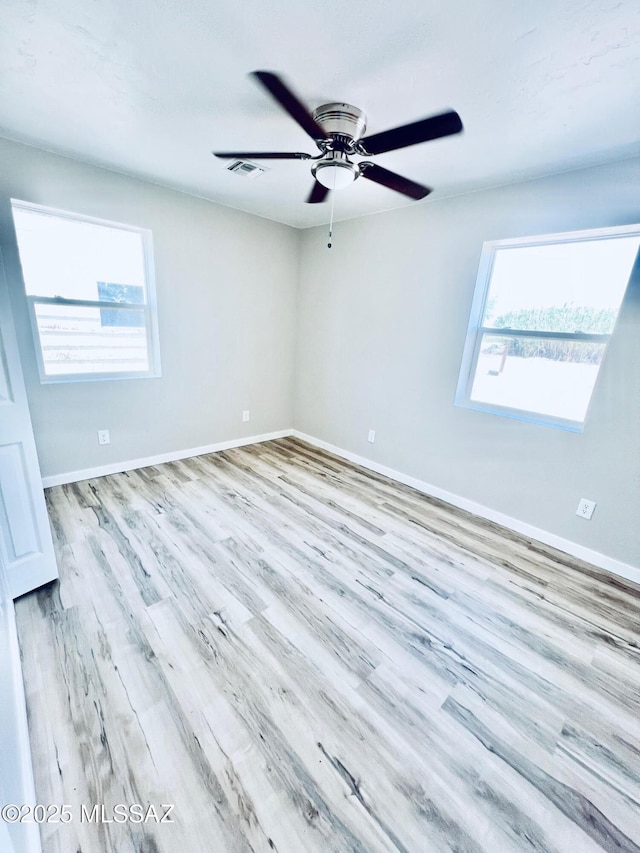 1105 S 1st Ave, Safford, AZ 85546 - spare room featuring wood finished floors and ceiling fan