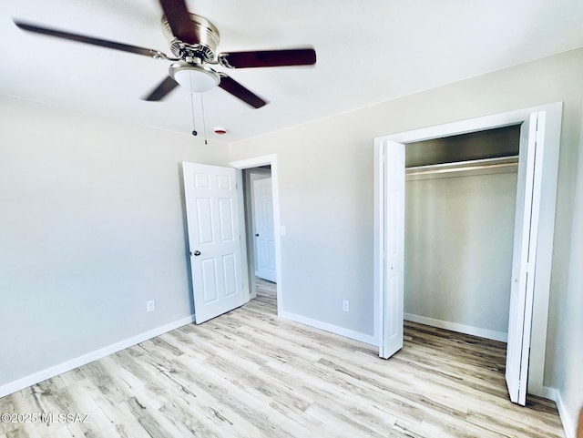 1105 S 1st Ave, Safford, AZ 85546 - unfurnished bedroom with wood finished floors, a closet, and ceiling fan