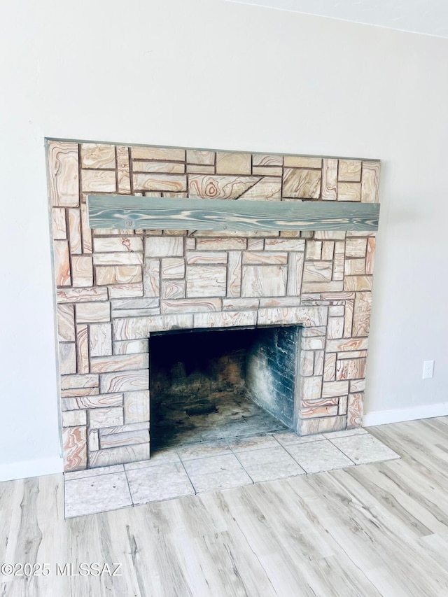 1105 S 1st Ave, Safford, AZ 85546 - detailed view of a stone fireplace and wood finished floors