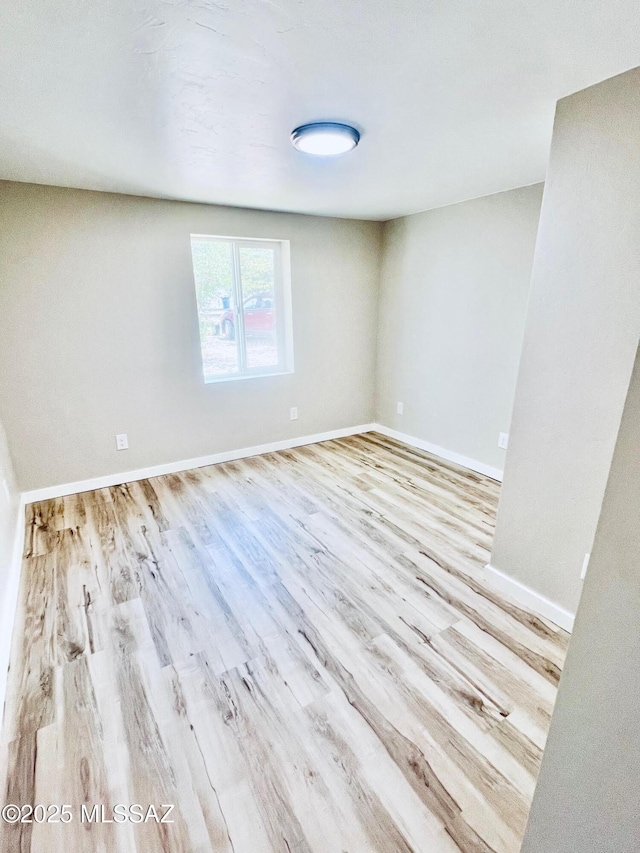 1105 S 1st Ave, Safford, AZ 85546 - spare room featuring wood finished floors and baseboards