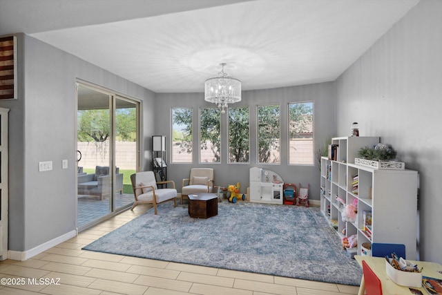 8470 N Gaetano Loop, Tucson, AZ 85742 - living area with healthy amount of natural light, a chandelier, and wood finished floors