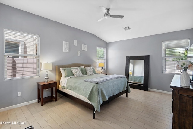 8470 N Gaetano Loop, Tucson, AZ 85742 - bedroom featuring vaulted ceiling, light wood-type flooring, and a ceiling fan