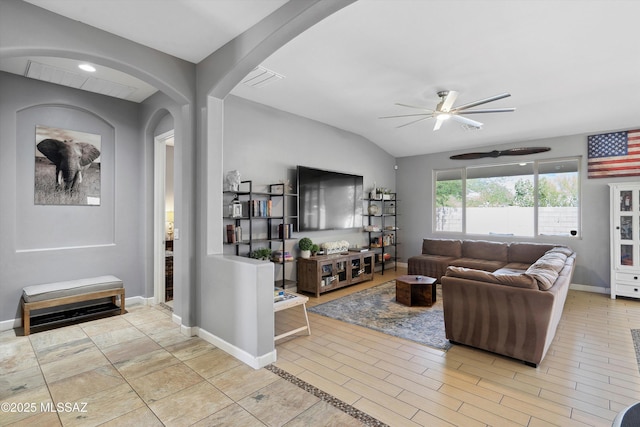 8470 N Gaetano Loop, Tucson, AZ 85742 - living area featuring ceiling fan, arched walkways, and lofted ceiling