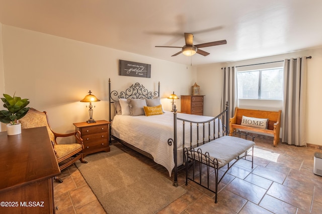 1120 N La Canoa, Green Valley, AZ 85614 - bedroom featuring stone finish flooring and ceiling fan