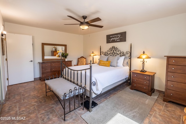 1120 N La Canoa, Green Valley, AZ 85614 - bedroom featuring stone finish floors and a ceiling fan