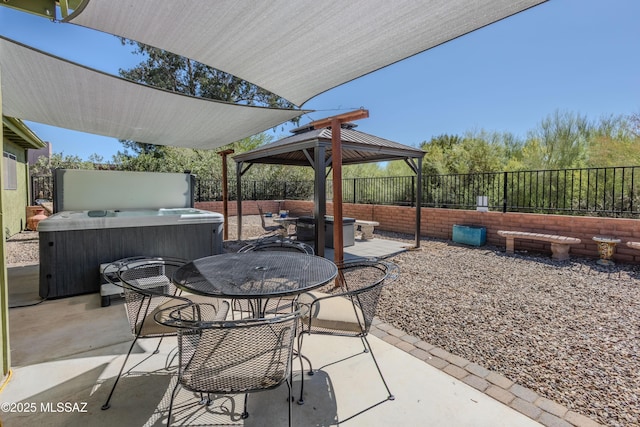 1120 N La Canoa, Green Valley, AZ 85614 - fenced backyard featuring a hot tub, a patio area, a gazebo, and outdoor dining area