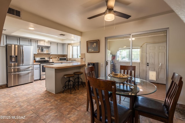1120 N La Canoa, Green Valley, AZ 85614 - dining area featuring ceiling fan and a raised ceiling