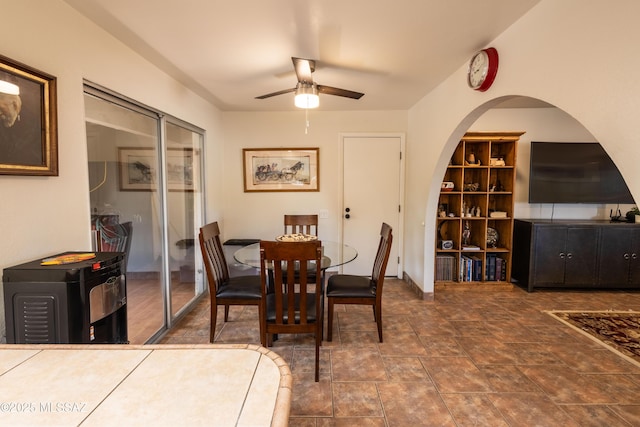 1120 N La Canoa, Green Valley, AZ 85614 - dining room featuring ceiling fan and arched walkways