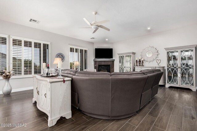 5371 W Leatherflower Ln, Marana, AZ 85658 - living area with ceiling fan, dark wood finished floors, a fireplace, and recessed lighting