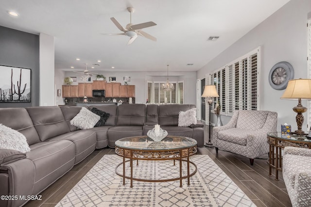 5371 W Leatherflower Ln, Marana, AZ 85658 - living area featuring a ceiling fan, dark wood-type flooring, recessed lighting, and a chandelier